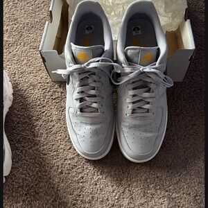 Nike Light Gray Sneakers with Yellow Accents